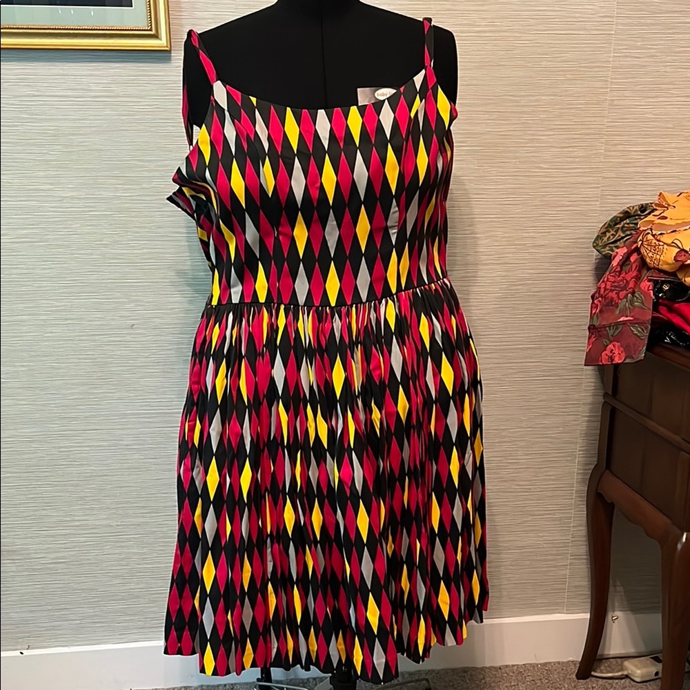 PUG Jenny dress in red and yellow harlequin print